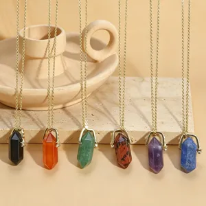 Detailed view of multi-color double-terminated crystal hexagonal pillar necklaces with gold chains.