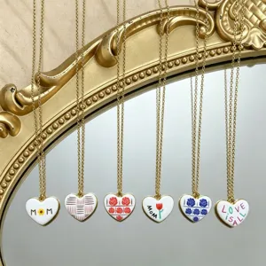 Chic enamel heart pendant necklace with fashion letters and floral design for women.