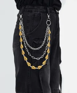 Details of the stylish multi-layer metal pants chain featuring cute money bag charms for hip-hop style.