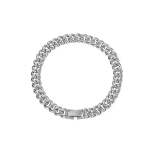 Close-up detail of silver cuban link chain necklace, minimalist metal jewelry accessory.