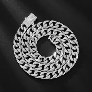Chunky silver Cuban link chain necklace with iced-out pave clasp, hip-hop statement jewelry.