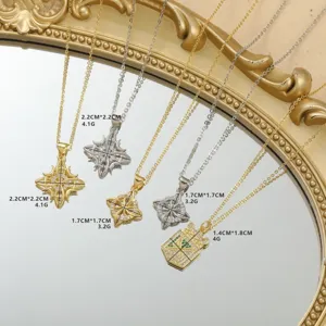 Vista detallada de collares con colgante de estrella geométrica moderna en oro y plata, chic.