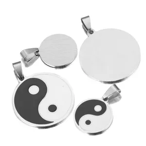 Stainless steel yin yang pendant detail showing front pattern and brushed back design.