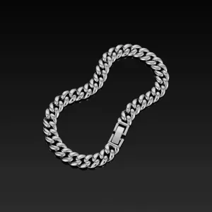 Detailed close-up of a stylish silver cuban link chain necklace with a secure clasp design.