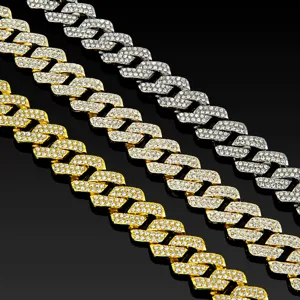 Detailed view of iced out 14mm Cuban link chains in gold and silver, stylish hip hop jewelry.