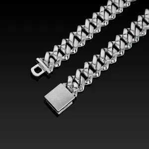 Close-up detail of a 14mm thick silver Cuban link chain necklace with secure box clasp.