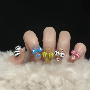 3D bikini press-on nails summer beach vacation style false nail art with cute patterns detailed view.