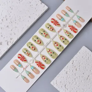 Detail view of clown mask press on nails, 3D resin almond artificial nail art patches.