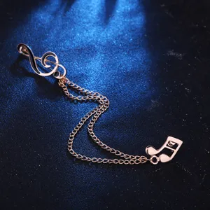 Exquisite music note brooch with double chain tassel design, perfect for suit collar or shirt.