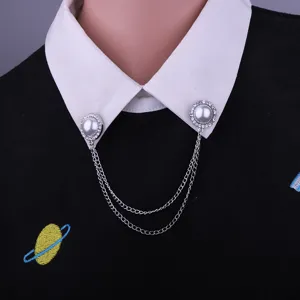 Close-up detail view of rhinestone faux pearl collar chain brooch, stylish shirt accessory pin.