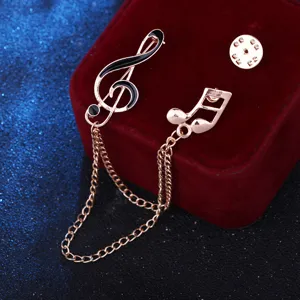 Rose gold music note brooch with chain tassel for suits and shirts, stylish collar pin.