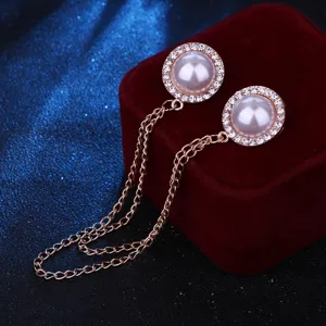 Detail view of the pearl rhinestone chain brooch collar pin for stylish shirt accessories.