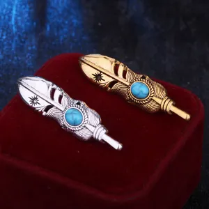 Vintage feather brooch with blue turquoise stone, dual gold and silver metal alloy accessories.