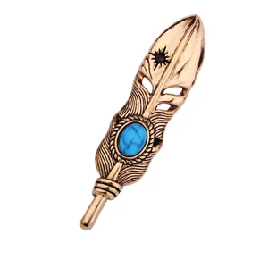 Vintage turquoise feather brooch for men, retro hollow metal lapel pin jewelry item.