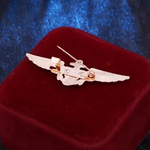 Rose gold tone aviation pilot wings pin metal badge military uniform brooch accessory detail view