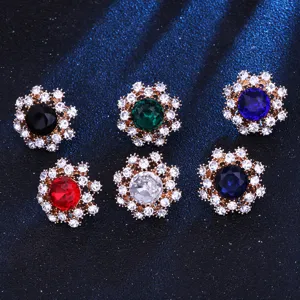 Close-up of crystal gemstone lapel pins in multi-colors, exquisite small suit collar decor details.