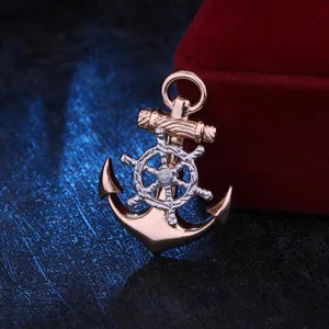 Close-up of a rotatable nautical anchor ship wheel brooch in dual tone rose gold and silver.