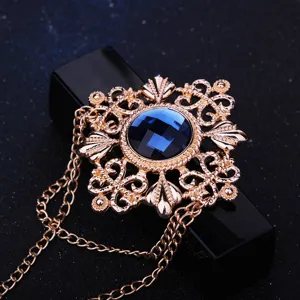 Vintage heren broche met blauwe edelsteen kwast ketting pak reversspeld mooie detail