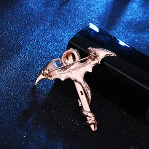 Close-up view of the back pin structure of the vintage retro dragon sword brooch accessory.