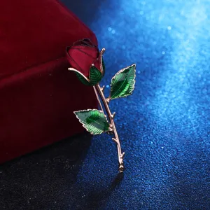 Elegant fabric rose brooch with metal stem, ideal Valentine gift and evening dress accessory.