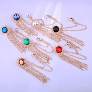 Detailed view of vintage multi-color gemstone tassel brooch suit chain accessory badge.