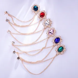 Vintage court style crystal brooch pin with gold chain tassel, elegant multi-color gemstone detail.