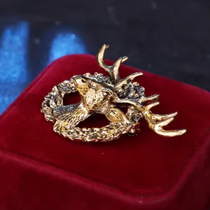 Vintage gold-toned elk head brooch pin, 3D deer antler badge for suit jacket, unisex fashion jewelry.