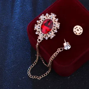 Vintage court style red crystal metal brooch with chain tassel for fashion accessories.