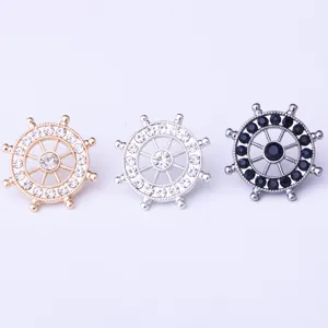 Detailed close-up of three nautical ship wheel rhinestone snap button accessories set.