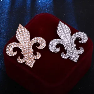 Exquisite rhinestone fleur-de-lis brooch set in rose gold and silver, perfect for blazers.