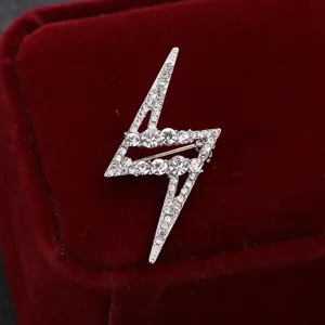 Detailed view of a stylish rhinestone lightning bolt brooch, perfect for apparel decoration.