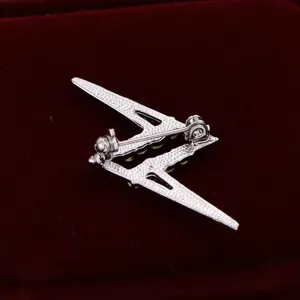 Silver tone lightning bolt brooch pin back detail, secure safety clasp fashion jewelry accessory.