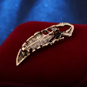Vintage hollow feather brooch for men, retro bronze lapel pin clothing accessory.