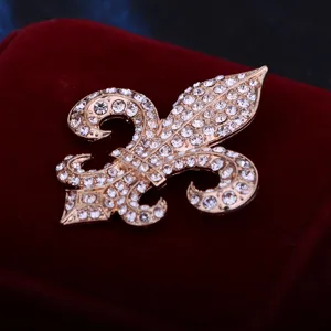 Fleur-de-lis rhinestone brooch detail view, luxury crystal lapel pin for suit and coat.