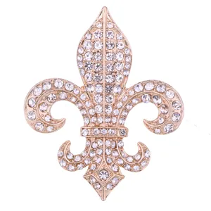 Exquisite rhinestone fleur-de-lis lapel pin, rose gold suit brooch accessory detail.