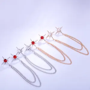 Detailed view of sparkling star collar pin with tassel chains, exquisite brooch jewelry.