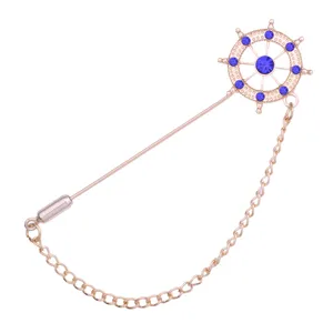 Gold-tone ship helm lapel pin with blue crystal rhinestones and chain for men suits.