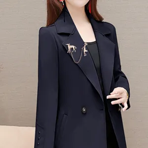 Exquisite dog walking brooch detail, elegant metal pet pin accessory for stylish coats.
