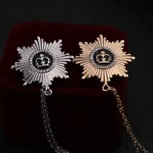Close-up detail of vintage crown star tassel brooch pin lapel badge for men suit.