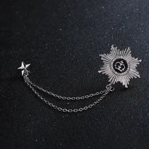 Close-up detail of the retro sunburst crown and star brooch with dual chains for men suits.