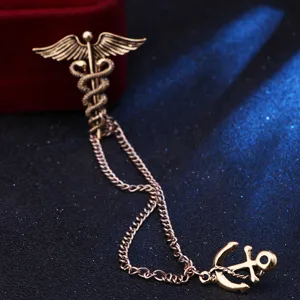 Vintage cadmium anchor brooch pin, retro winged snake design, cool men's suit accessory.