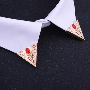 Vintage gold tone triangular collar tips with red enamel inlay, classic retro shirt pins accessory.