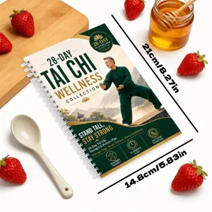 Detailed view of the 28-day tai chi wellness spiral planner notebook with fresh strawberries.