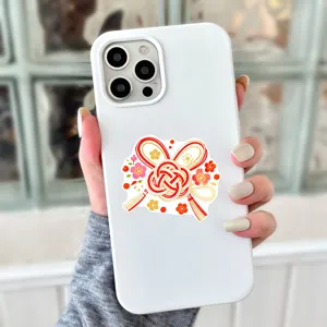 Japanese style traditional knot sticker detail on white phone case, clean minimalist aesthetic design.