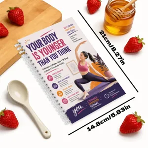 Vista dettagliata del taccuino a spirale per pilates da 28 pagine con guida fitness.