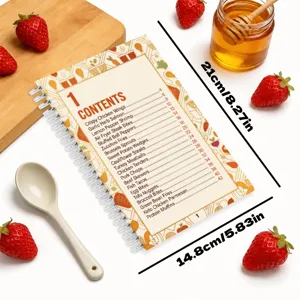 Detailed view of spiral recipe notebook contents page with cooking list, styled with props.