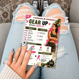 Fitness planner detail shot showing daily workout schedule and gear guide for home training routines.