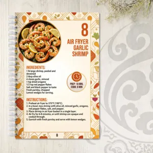 Detailed view of the air fryer garlic shrimp recipe page in a portable spiral recipe notebook.