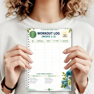 30-day body reset plan workout log spiral notebook with daily tracking and weekly summary.