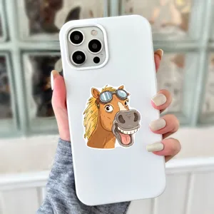 White phone case with funny cartoon horse sticker wearing goggles, detailed product shot display.